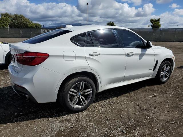 Obraz 3 z 2017 BMW X6 XDRIVE50I 2017 z VIN 5UXKU6C36H0W38365