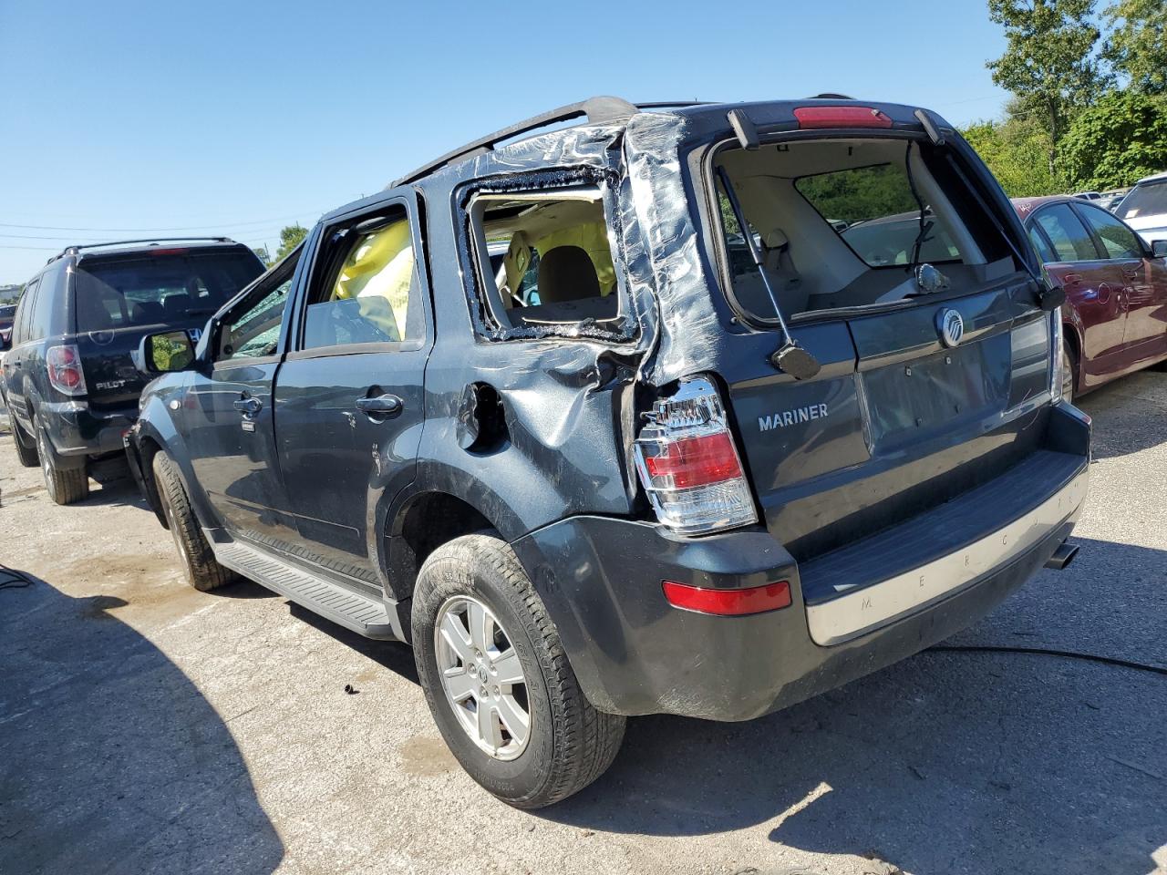 Изображение 2 Mercury Mariner 2009 с VIN 4M2CU81G39KJ23105