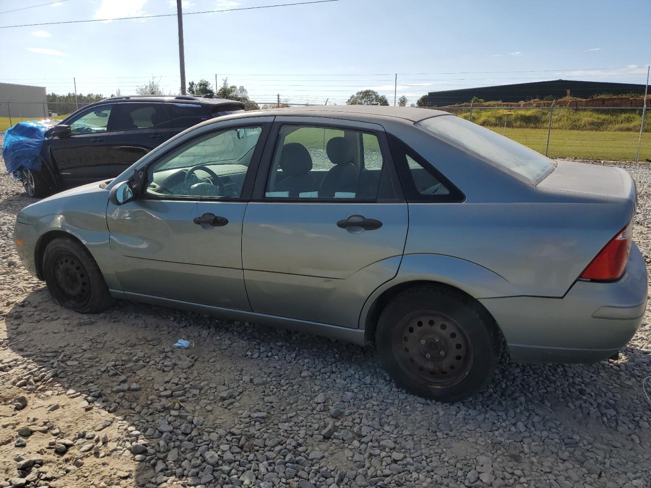 Obraz 2 z 2005 FORD FOCUS ZX4 2005 z VIN 1FAFP34N75W155510
