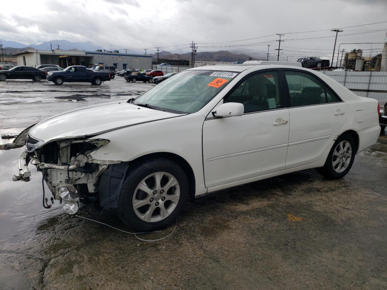 Obraz 1 z 2004 TOYOTA CAMRY LE 2004 z VIN JTDBE32K240255250