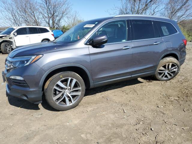 Obraz 1 z 2018 HONDA PILOT TOURING 2018 z VIN 5FNYF6H98JB008132