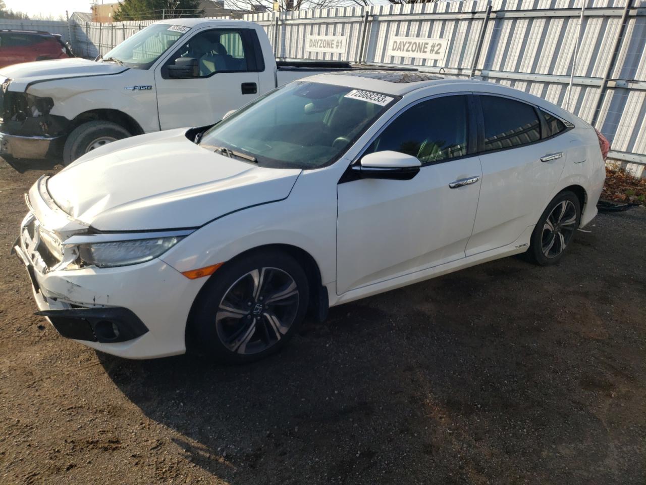 Изображение 1 Honda Civic Touring 2016 с VIN 2HGFC1F99GH101011
