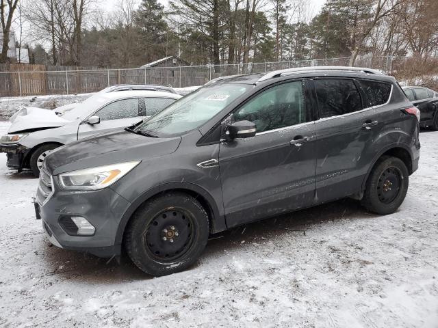 Image 1 of 2017 FORD ESCAPE TITANIUM 2017 with VIN 1FMCU9J91HUD87743