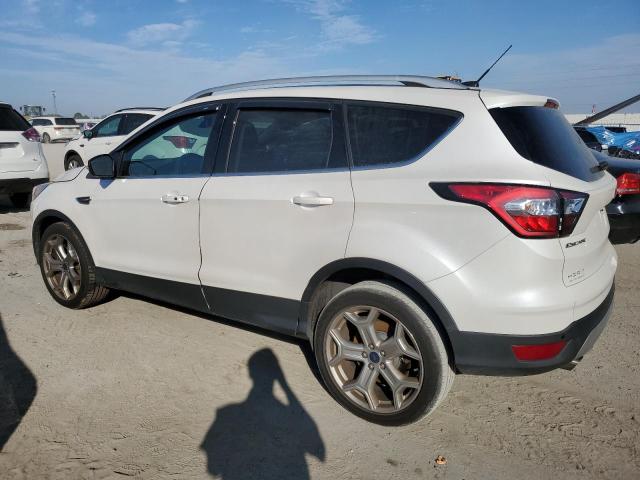 Изображение 2 2017 FORD ESCAPE TITANIUM 2017 с VIN 1FMCU0JD1HUC23148