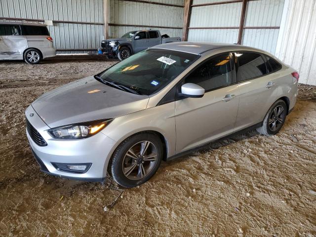 Image 1 of 2018 FORD FOCUS SE 2018 with VIN 1FADP3FE7JL216516