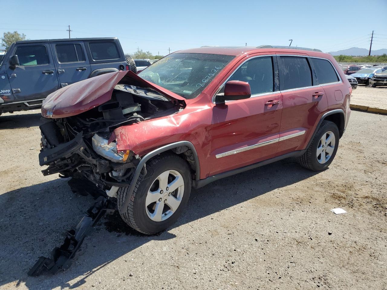 Image 1 of 2012 JEEP GRAND CHEROKEE LAREDO 2012 with VIN 1C4RJFAG3CC287176
