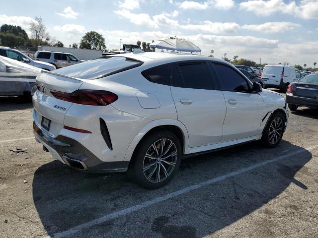 Obraz 3 z 2020 BMW X6 M50I 2020 z VIN 5UXCY8C09L9C75612