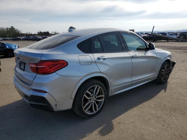 Obraz 3 z 2015 BMW X4 XDRIVE28I 2015 z VIN 5UXXW3C55F0F89093